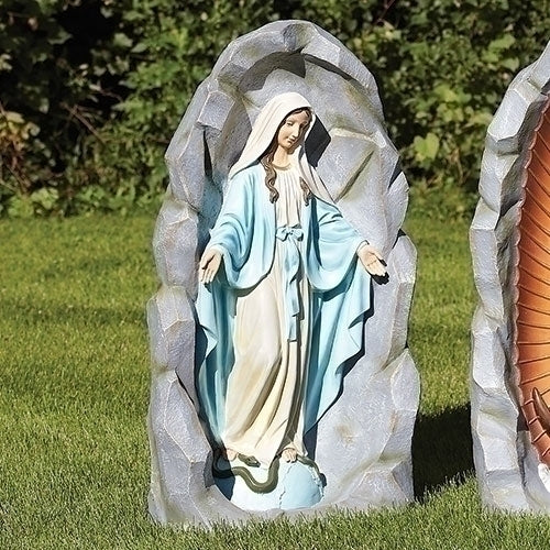 Our Lady of Grace garden statue 36 inches tall in blue and cream tones set within a textured grotto backdrop outdoors