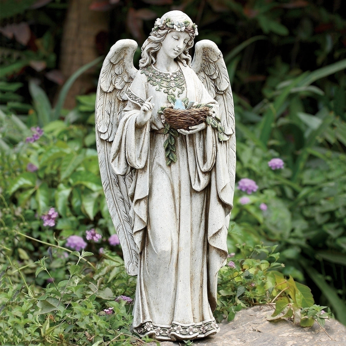24-inch garden statue of an angel holding a nest, symbolizing peace, protection, and new beginnings.
