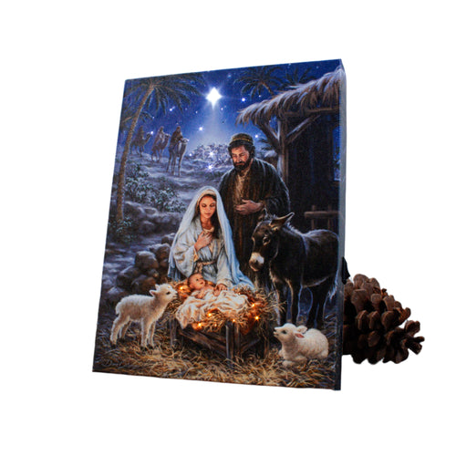 A Savior is Born" 8x6 lighted tabletop canvas depicting Nativity scene with Mary, Joseph, baby Jesus, animals, and starry night.