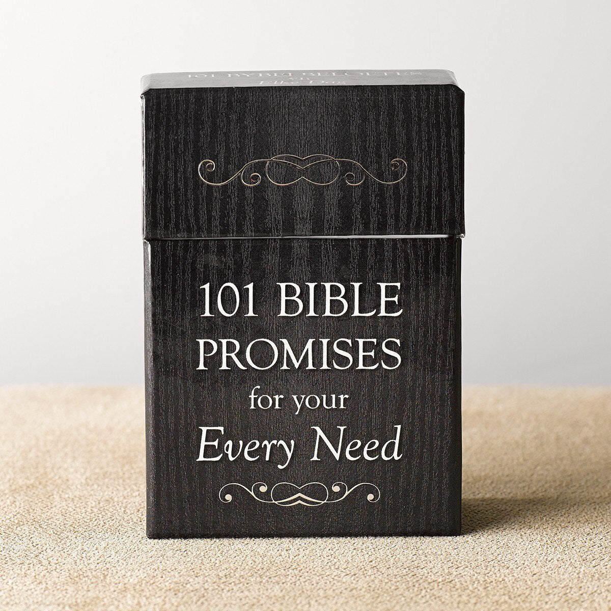 Black sturdy lidded box with white text "101 Bible Promises for Your Every Need" and decorative gold scrollwork