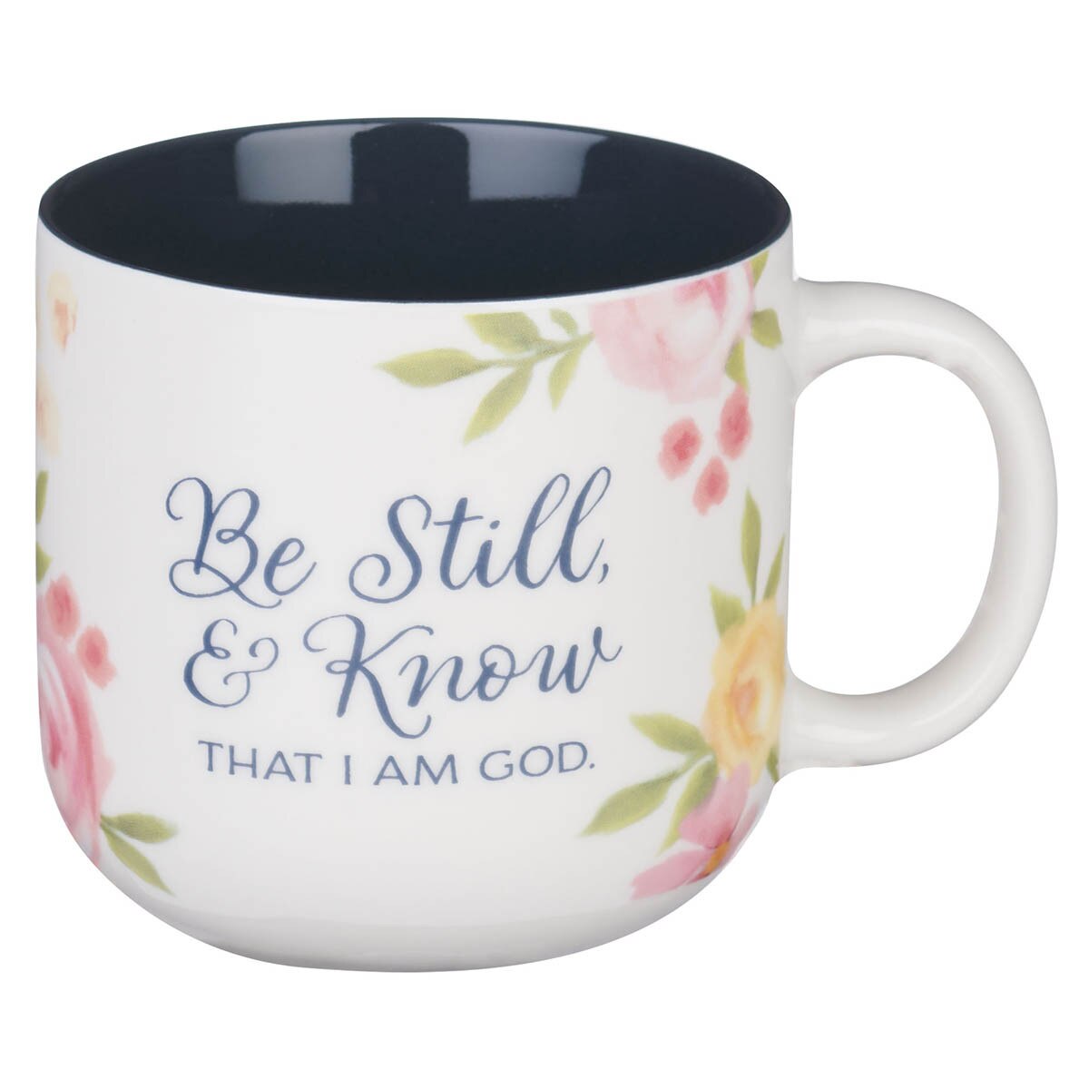 White ceramic coffee mug with painted pink and yellow peonies and Psalm 46:10 scripture text in blue font
