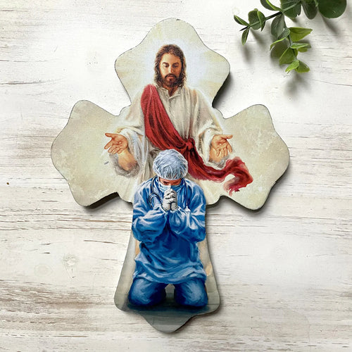 6"x8" wood wall cross featuring praying healthcare worker and Jesus with red sash in protective blessing pose