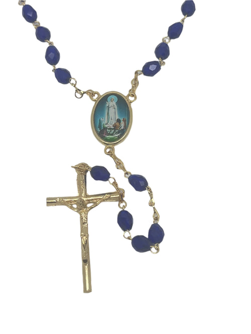 Our Lady of Fatima dark blue crystal rosary with gold-tone crucifix and oval centerpiece featuring Marian apparition image