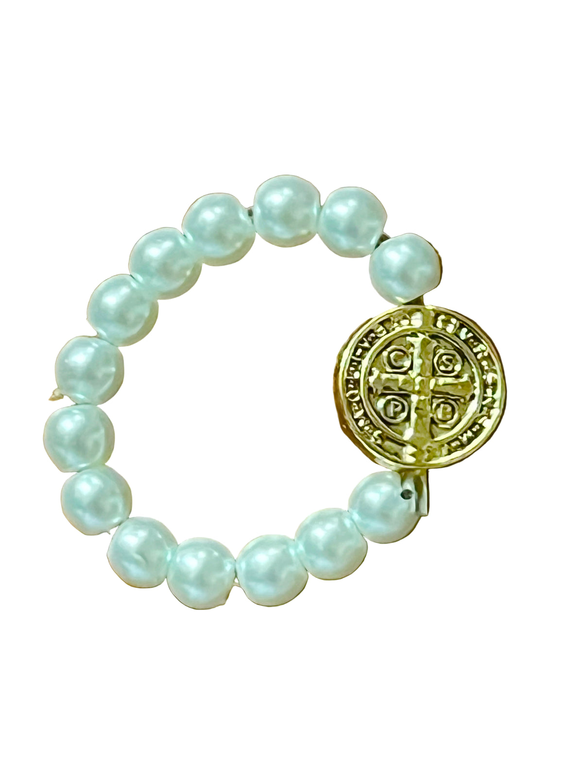 White bead stretch ring featuring a gold-toned Benedict medal, blending faith symbolism with elegant design