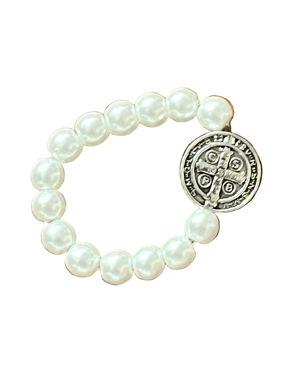 White and silver stretch ring with pearl-like beads and a detailed Benedict Medal charm for faith and protection