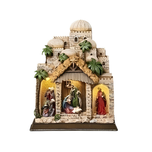 11" Lighted Nativity in Town tabletop ornament with Holy Family scene, stone buildings, palm trees, and glowing stable interior