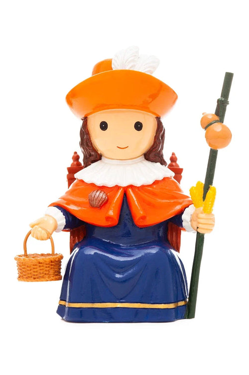 3.5" Niño de Atocha Collector's Edition figurine dressed as pilgrim with orange hat, cape, basket, and staff on white background