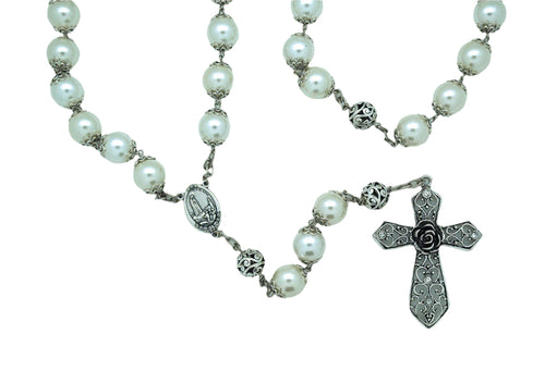 Pearl wall rosary with silver caps, detailed centerpiece medal, and ornate silver-tone cross with floral design