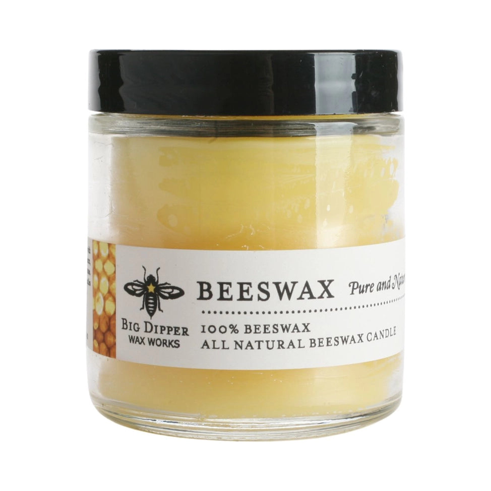 Clear glass jar with black lid holding 100% pure beeswax candle labeled Big Dipper Wax Works