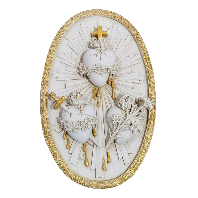 Oval wall plaque featuring three raised Sacred Hearts with gold accents and radiant rays in white and gold frame