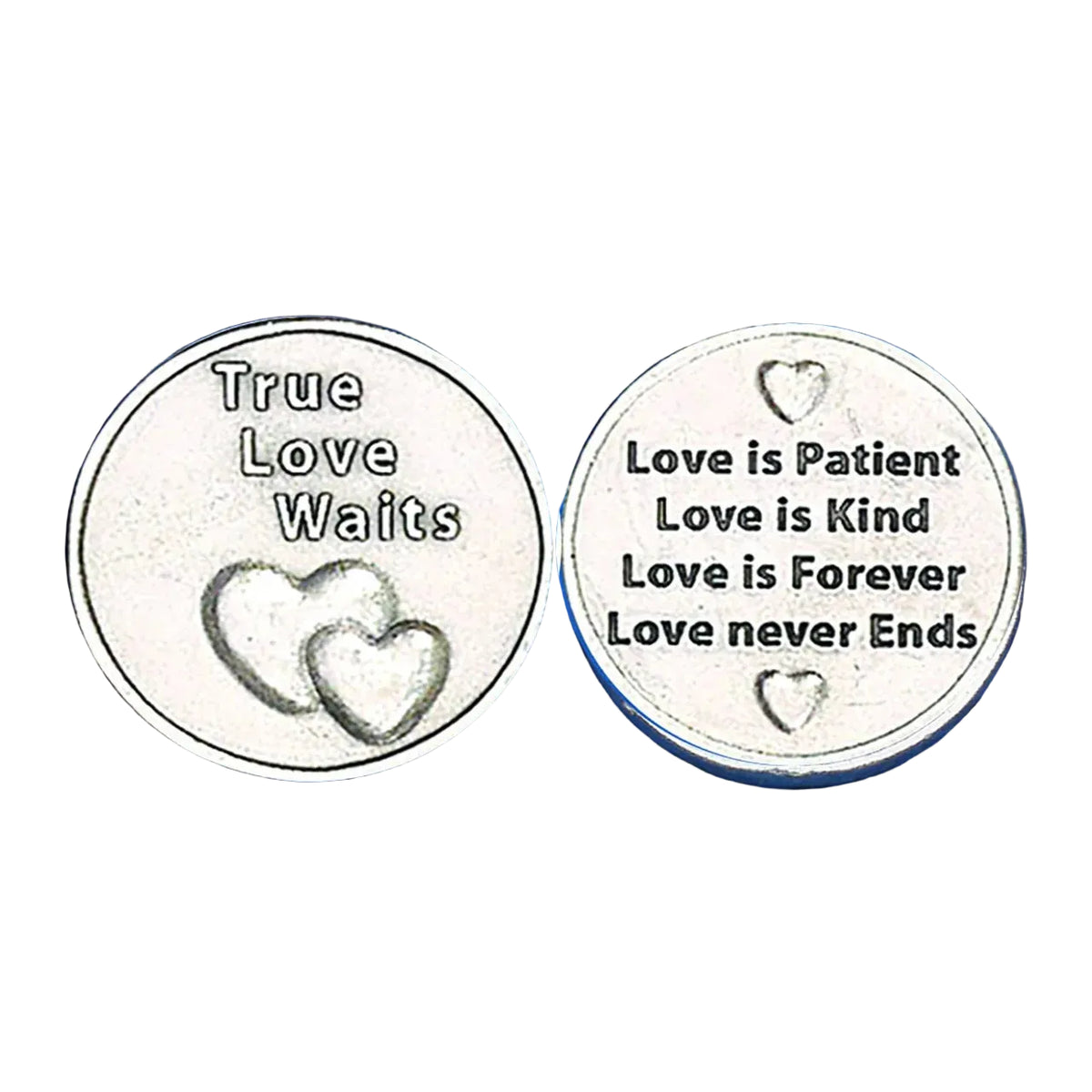 Two round silver-toned metal coins or medallions shown side by side on a textured blue background. The left coin reads 'True Love Waits' with two heart designs, and the right coin reads 'Love is Patient Love is Kind Love is Forever Love never Ends' with small heart motifs.
