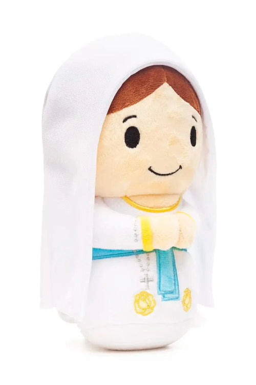 9" plush doll of Our Lady of Lourdes wearing white veil and blue sash with embroidered yellow roses and rosary details
