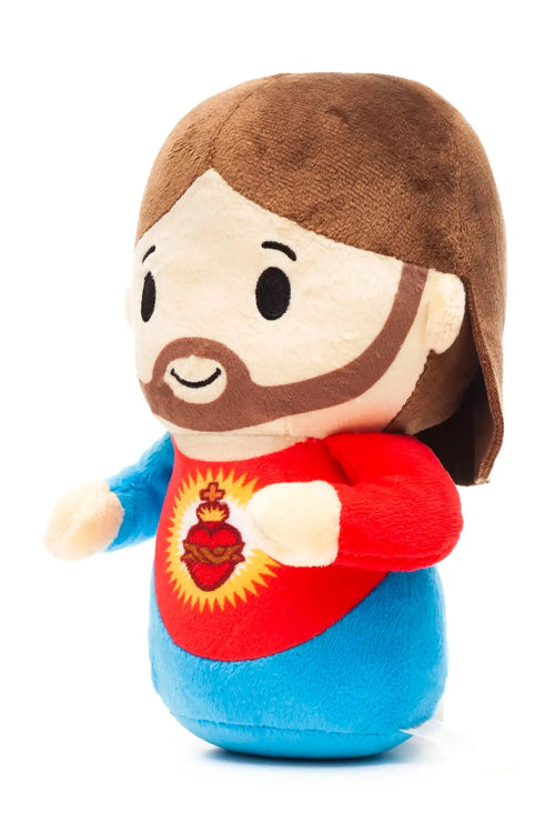 9" plush doll of Jesus wearing red and blue with embroidered Sacred Heart symbol on chest