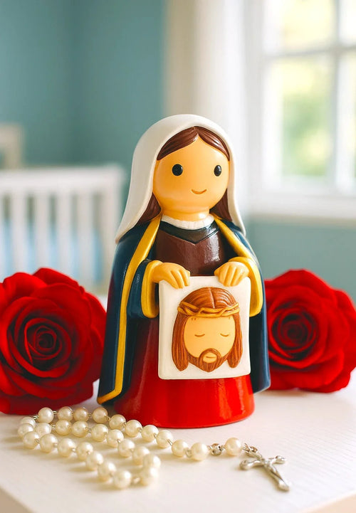 Hand-painted St. Veronica figurine holding face of Jesus icon with roses and white rosary beads on table