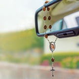 Handheld Holy Land olive wood rosary with Virgin Mary Medjugorje centerpiece and small metal crucifix on auto chain