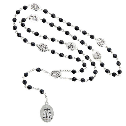 Seven Sorrows deluxe chaplet with black faceted beads and silver-tone religious medals on white background